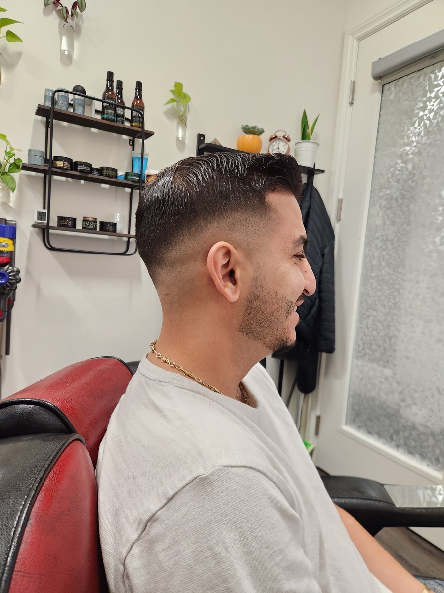 Fade haircut with textured top